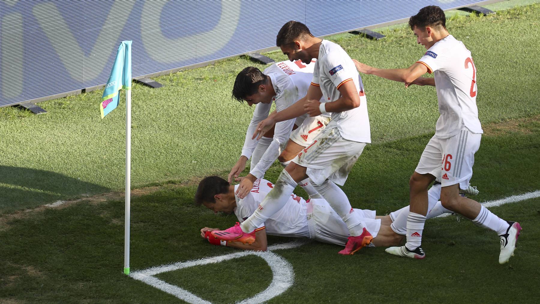 Spain's Cesar Azpilicueta, on the ground, celebrates with his teammates after scored against Croatia during the Euro 2020 soccer championship round of 16 match between Croatia and Spain, at Parken stadium in Copenhagen, Denmark, Monday, June 28, 2021.