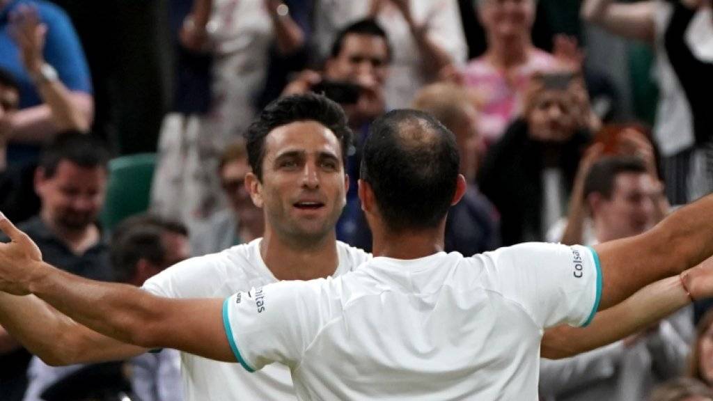 Die Erlösung nach einem epischen Final: Juan Sebastian Cabal (re.) und Robert Farah jubeln in Wimbledon über ihren ersten Grand-Slam-Titel