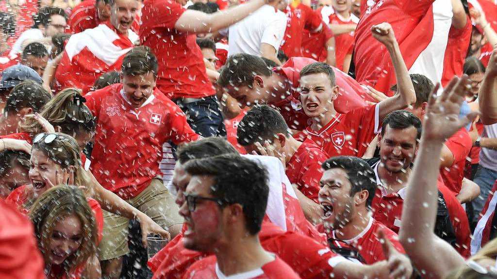 Fans of the Swiss soccer team celebrate during the match Switzerland against Costa Rica at a public viewing area in Winterthur, Switzerland, Wednesday, June 27, 2018.