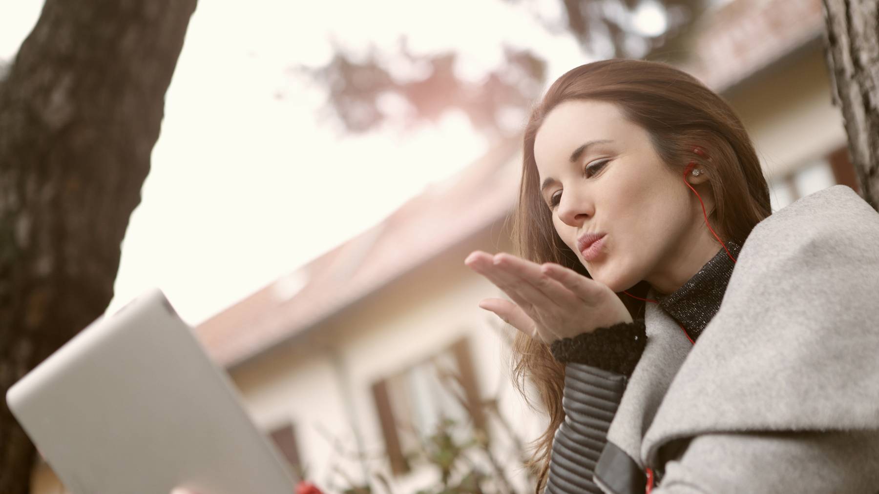 woman-in-gray-coat-having-a-video-call-3783118