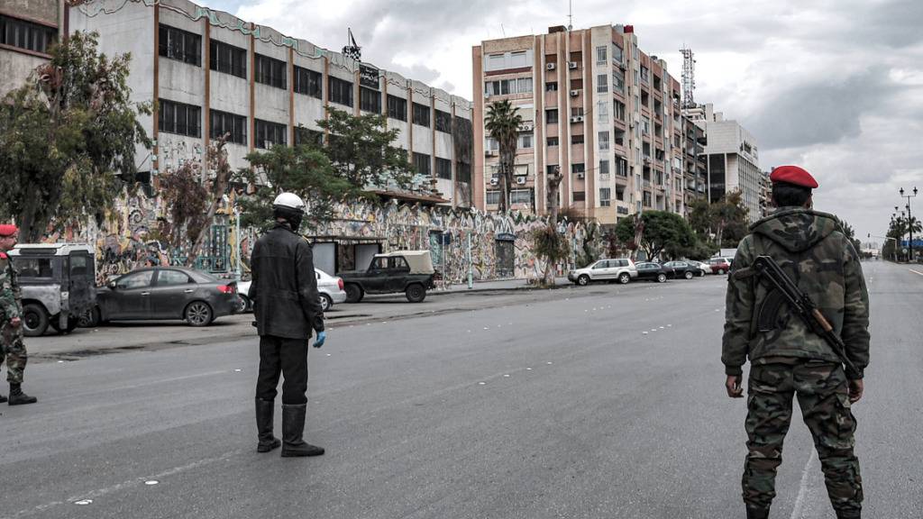ARCHIV - Sicherheitsbeamte auf einer Straße in Damaskus. (Archiv) Foto: -/SANA/dpa - ACHTUNG: Nur zur redaktionellen Verwendung und nur mit vollständiger Nennung des vorstehenden Credits