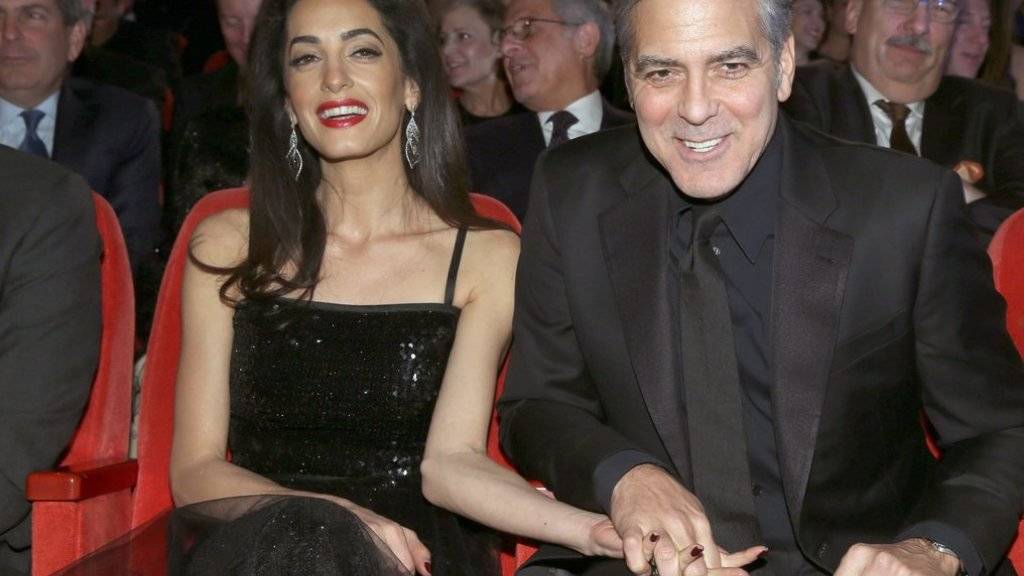 Roter Teppich, Besuch bei der deutschen Bundeskanzlerin, Filmvorstellung an der Berlinale: Zusammen kriegen Amal und George Clooney einfach alles gebacken (Archiv).
