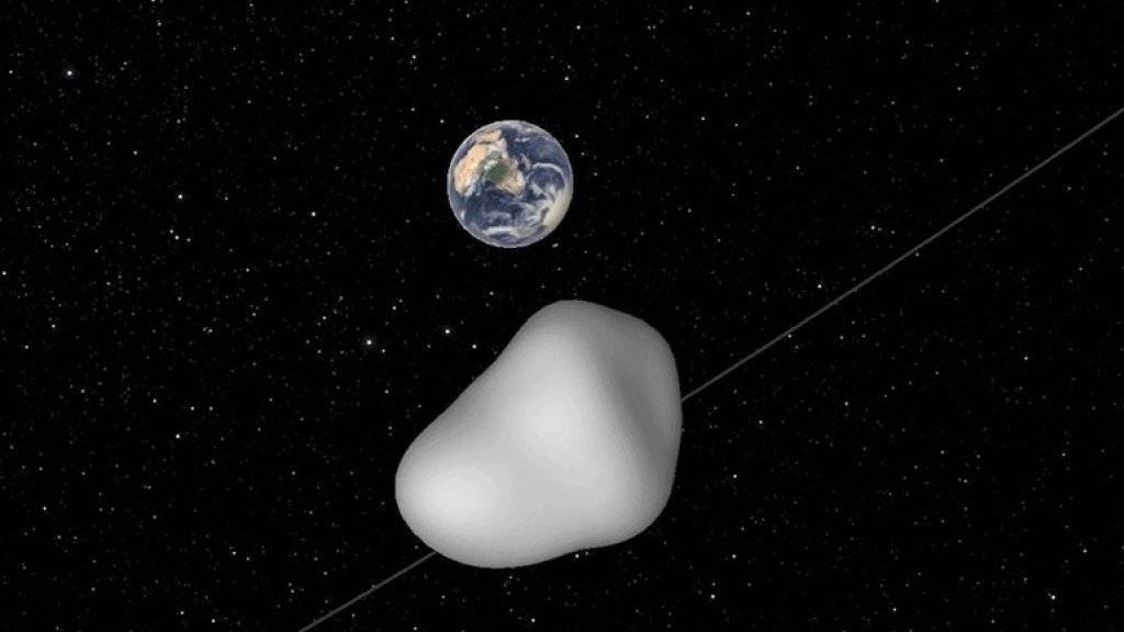 Eine Illustration zeigt den Vorbeiflug des Asteroiden 2012 TC4. Ein Wiedersehen mit dem Himmelskörper wird es erst im Jahr 2079 geben.