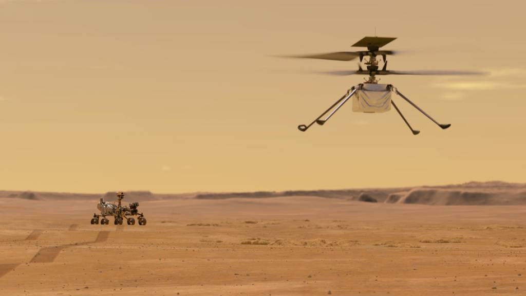 Just am 100. Jahrestag des ersten Helikopterflugs auf der Erde wird das Ereignis auf dem Mars wiederholt: Der Mini-Helikopter «Ingenuity» soll 90 Sekunden in der dünnen Mars-Atmosphäre navigieren. Links im Bild der Marsrover. (Nasa)